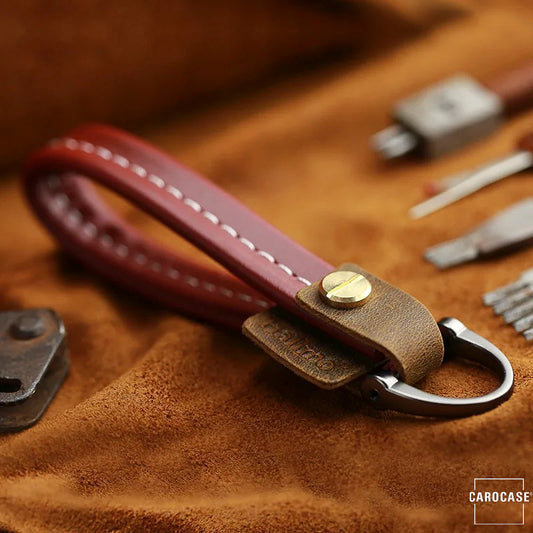 Premium keychain leather strap with accent stitching included. carbine