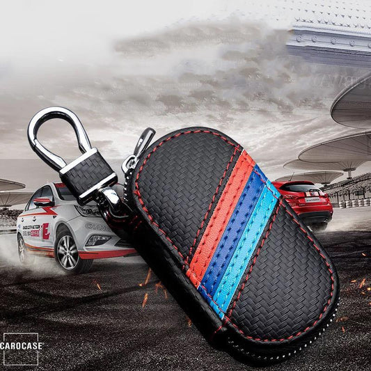 Key case including carabiner and in carbon look oval